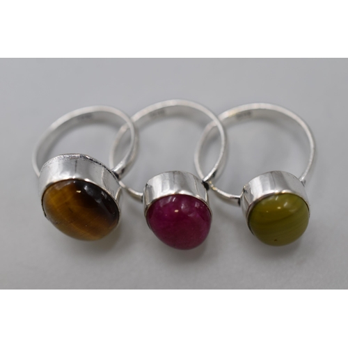 12 - 925 Silver ring Dark Ruby styled size R, Tigers Eye styled size M+5 and Moldavite styled size Q