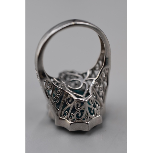 19 - Silver 925 blue stoned ring (size T)