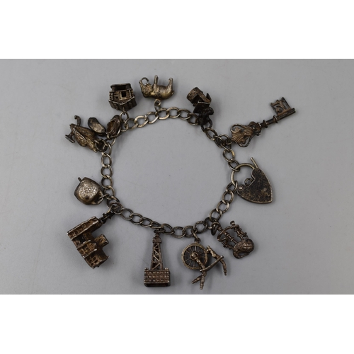 38 - Hallmarked Birmingham Silver Charm Bracelet with 11 Charms