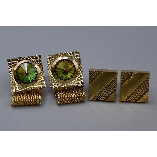 121 - Two pairs of gold toned cufflinks