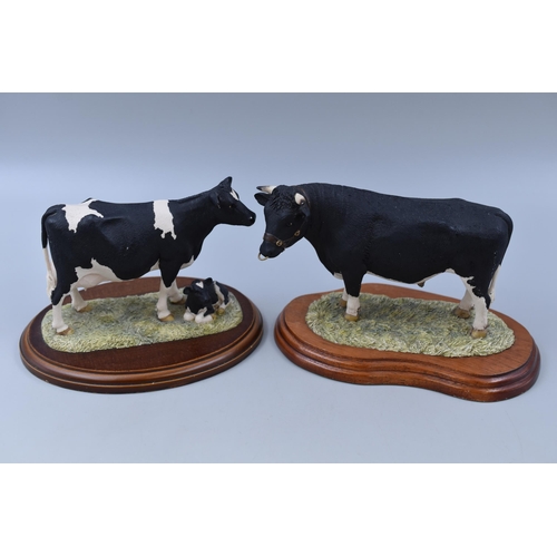 285 - Two Border Fine Arts Cow/Bull Figures on Wooden Plinths, Signed J A Butler. Tallest Approx 5