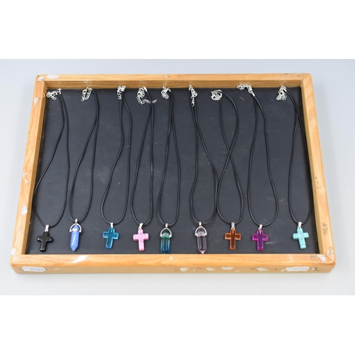 129 - Selection of 9 Hexagonal Column and Cross Pendants on Black Cord