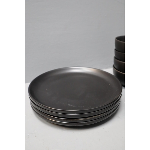 352 - An Eleven Piece Matte Black Dinner Service (Four Bowls, Four Dinner Plates, And Three Side Plates)