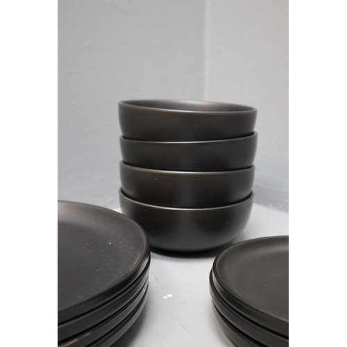 352 - An Eleven Piece Matte Black Dinner Service (Four Bowls, Four Dinner Plates, And Three Side Plates)