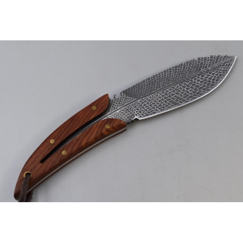 227 - Hunting feather blade knife in leather sheet