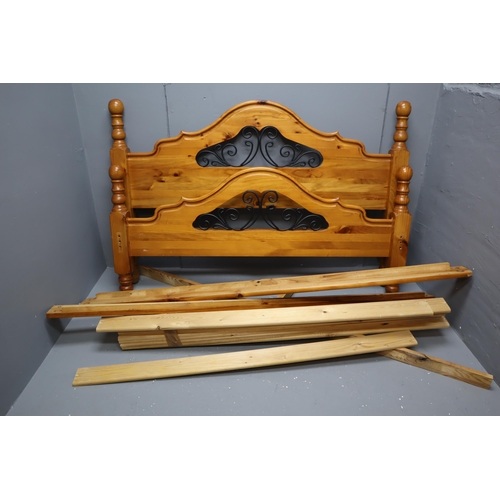 565 - One wooden double bed with onate headboards