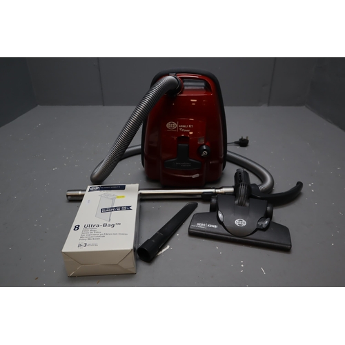 716 - A Red Sebo Airbelt K1 ePower Industrial Vacuum Cleaner, With Spare Bags. Powers On When Tested