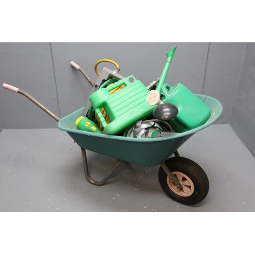 752 - Wheel barrow with two watering cans, hose lock reel hosepipe, weed sprayer and plant feeder