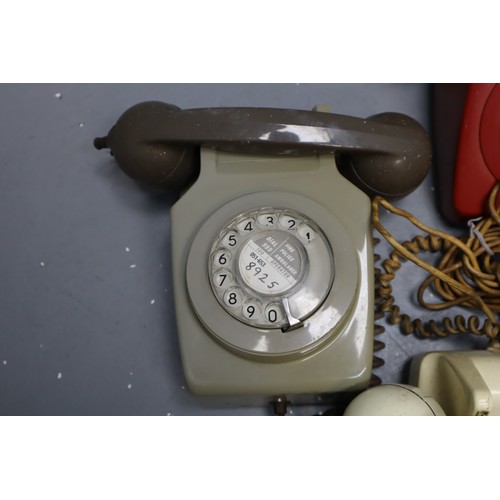 479 - Four vintage rotary telephones (grey one is wall mounted)