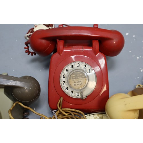 479 - Four vintage rotary telephones (grey one is wall mounted)