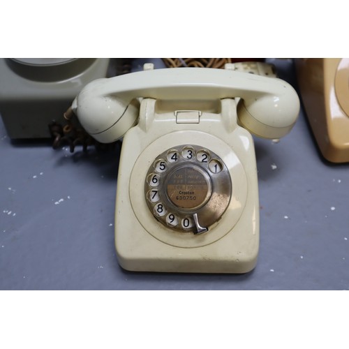 479 - Four vintage rotary telephones (grey one is wall mounted)