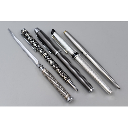 232 - Four pens to include two fountain, two ball point and a letter opener