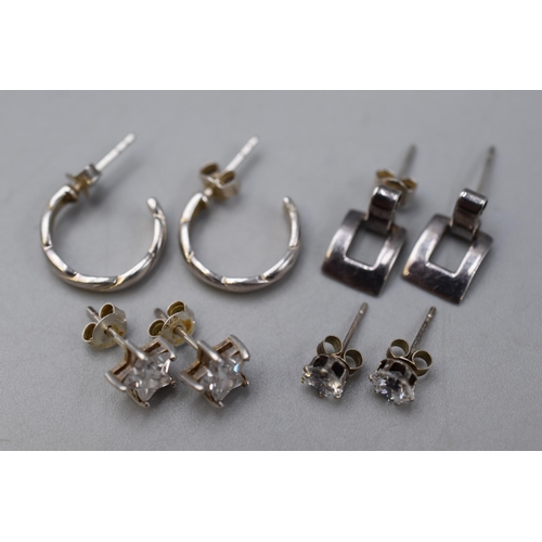 245 - Four Pairs of 925. Silver Earrings, To Include Clear Stoned Star Earrings