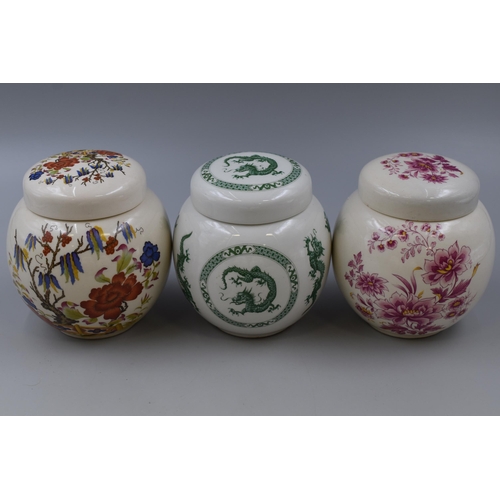 311 - Five floral patterned porcelain Sadler storage jars (one a/f)