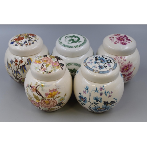 311 - Five floral patterned porcelain Sadler storage jars (one a/f)