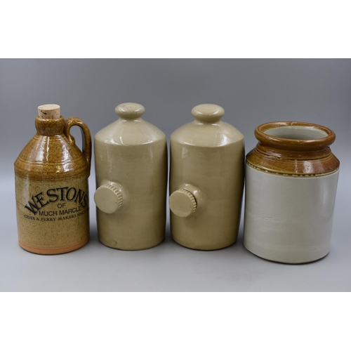 261 - Two vintage ceramic hot water bottles, Stoneware Planter and a Westons Cider Jug (10