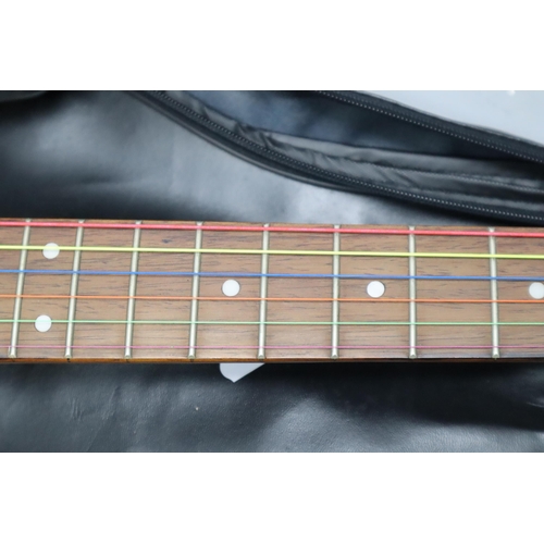 562 - An Encore Strat Style Electric Guitar, In JSH Guitar Bag With Jack. Encore Has Coloured Practice Str... 