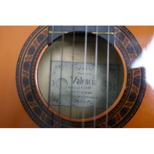 566 - A Valencia CG160 Classical Guitar With Original Carry Bag and A Guitar Strap