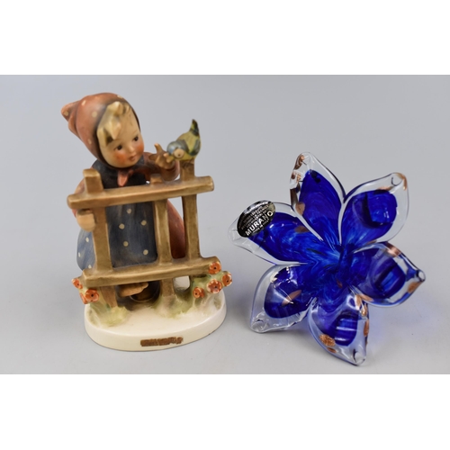 206 - A Goebel Signs of Spring Ceramic Figure, With Blue Art Glass Murano Flower