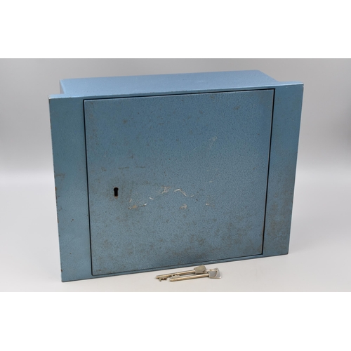 606 - A Heavy Cast Metal Floor Safe In Powder Blue, With Two Keys. Approx 12.5