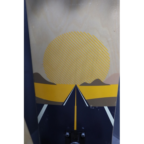 624 - Two full size, full grip adult skateboards both with a dynamic sunset artwork on the underside