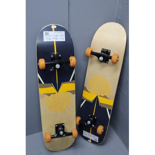 624 - Two full size, full grip adult skateboards both with a dynamic sunset artwork on the underside