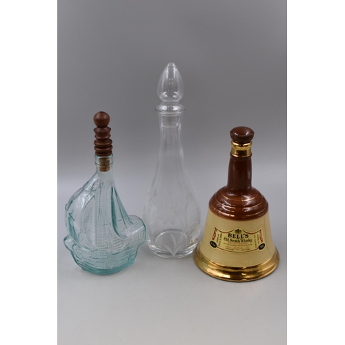 729 - Three Decanters To Include Bell's Scotch Whisky, Santa Maria Ship Decanter, And Other