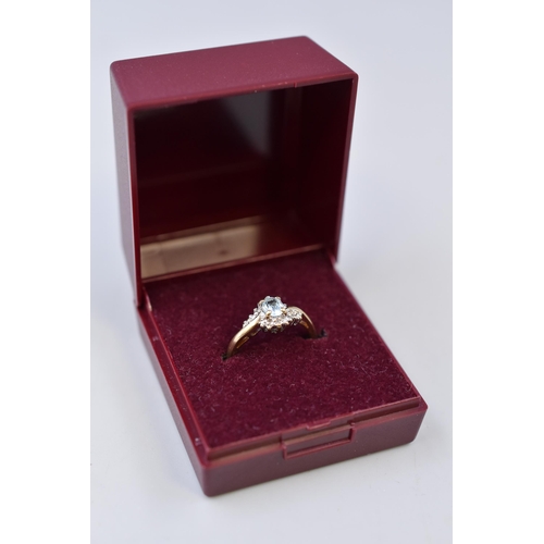 7 - Hallmarked London 375 (9ct) Gold Aquamarine set in Diamond Mount Ring Complete with Presentation Box