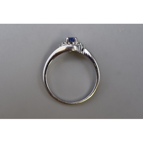 26 - White Gold 375 (9ct) Tanzanite and Diamond Stoned Ring (Size O) Complete with Presentation Box