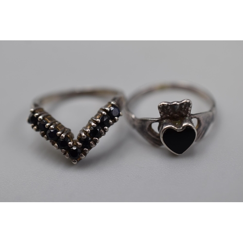 33 - Two silver 925 rings to include Claddagh heart ring and vintage wish bow ring (sizes I and K)