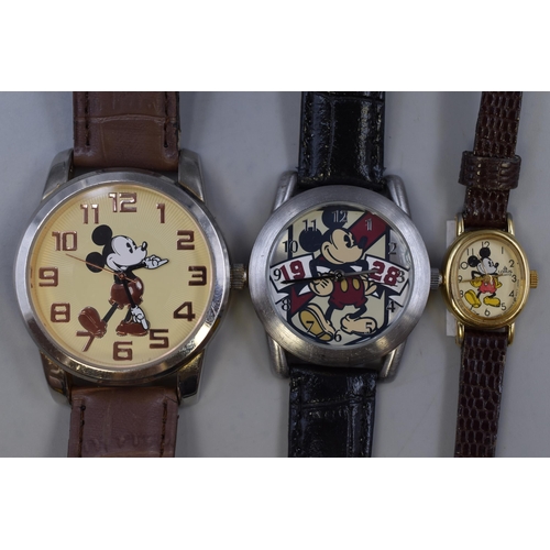 121 - Three vintage Mickey Mouse watches to include a Lorus Mickey Mouse watch (working)