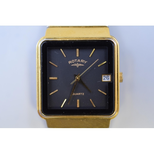 123 - A Rotary Quartz Gold Tone and Black Face Day/Time Watch, In Presentation Case. Working