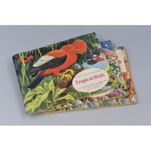 220 - Three Brooke Bond picture card books, African wild life, Wild flowers series 2 and Tropical birds (A... 