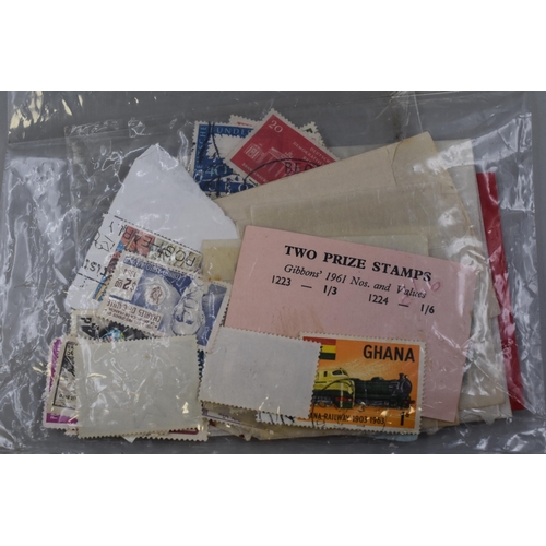 221 - Selection of stamps to include a Lincoln stamp album, XLCR postage stamp album and a plastic wallet ... 