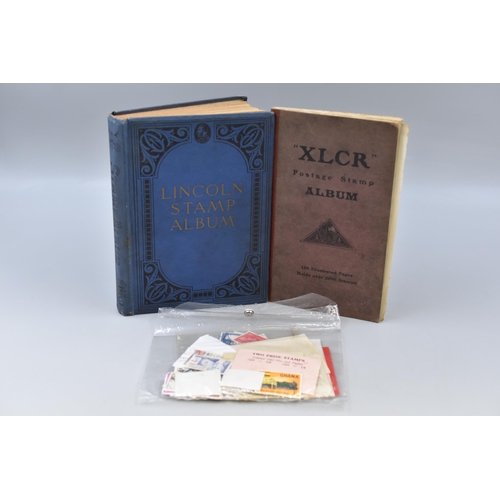 221 - Selection of stamps to include a Lincoln stamp album, XLCR postage stamp album and a plastic wallet ... 