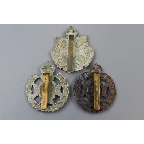 314 - Three military cap badges to include Rifle Brigade, 5th Battalion border Cumberland regiment and Rob... 