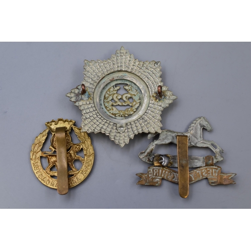 315 - Three Military cap badges to include Cheshire regiment, West Yorkshire regiment and York & Lanca... 