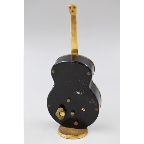 255 - Vintage Swiza 7 jewels decorative guitar clock (12 1/2
