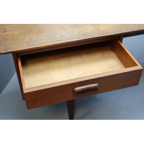 670 - A mid 20th century dressing table with four short drawers and rectangular mirror by Younger from the... 