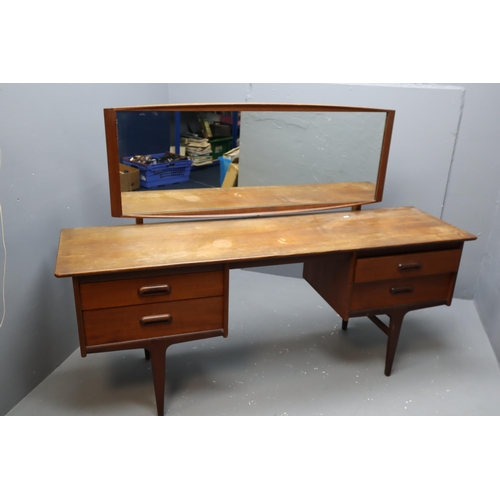 670 - A mid 20th century dressing table with four short drawers and rectangular mirror by Younger from the... 