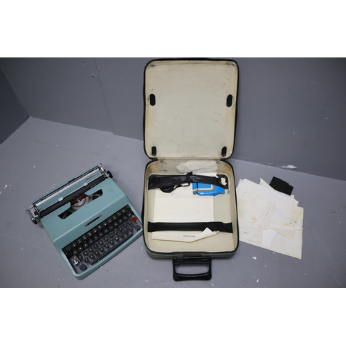 493 - Vintage blue Lettera 32 typewriter completed in carry case