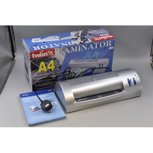 643 - Boxed A4 Laminator complete with a pack of Pouches Powers on when tested