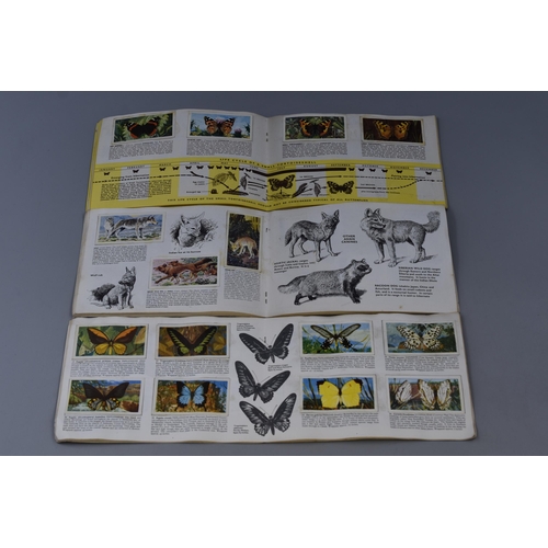 498 - Three Brooke Bond picture card books, Butterflies of the world, Asian wild life and British Butterfl... 