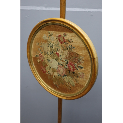 678 - A Victorian satin walnut pole screen with Berlin needlework floral glazed adjustable banner