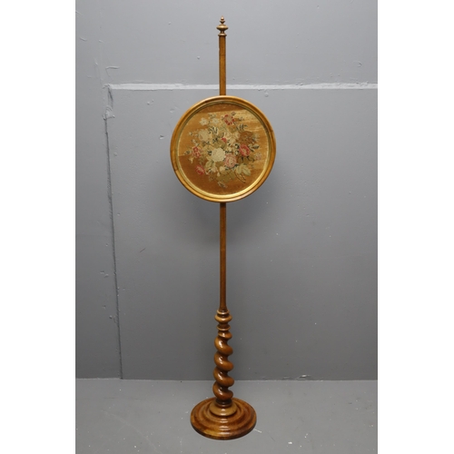 678 - A Victorian satin walnut pole screen with Berlin needlework floral glazed adjustable banner