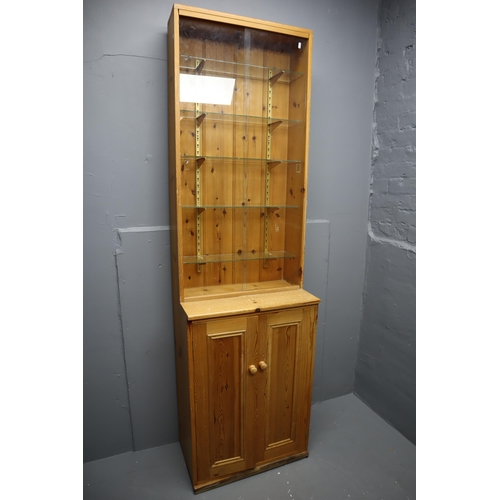 663 - Slimline Pine Display Unit with Under Cupboard Storage Topped off with a Five Tier Glass Shelf Displ... 