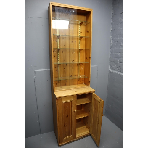 663 - Slimline Pine Display Unit with Under Cupboard Storage Topped off with a Five Tier Glass Shelf Displ... 