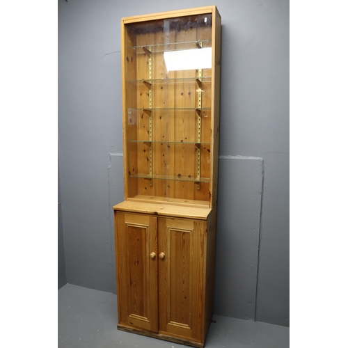 663 - Slimline Pine Display Unit with Under Cupboard Storage Topped off with a Five Tier Glass Shelf Displ... 