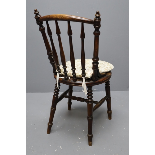 692 - Two spindle back bentwood chairs with cushion pads attached (28 1/2