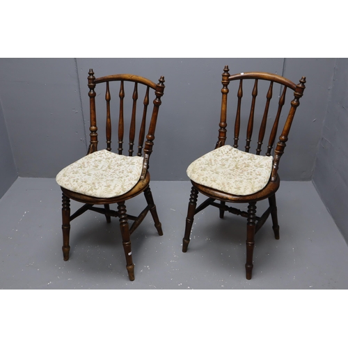 692 - Two spindle back bentwood chairs with cushion pads attached (28 1/2